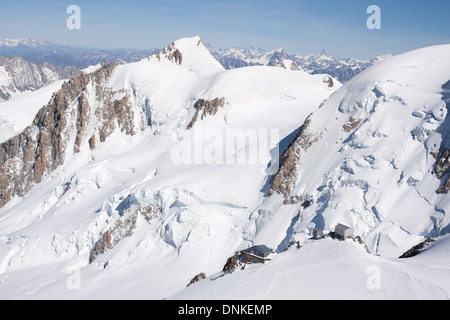 AERIAL VIEW. Vallot hut (right building) and the observatory / laboratory (left building) with Mont Maudit behind. Chamonix, Haute-Savoie, France. Stock Photo