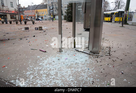 Berlin, Germany. 01st Jan, 2014. A destroyed phone booth and trash from New Year's Eve are picture in Berlin, Germany, 01 January 2014. People from all over the world gathered along the historical Straße des 17. Juni (17th of June Street) to ring in the year 2014. Photo: JOERG CARSTENSEN/dpa/Alamy Live News Stock Photo