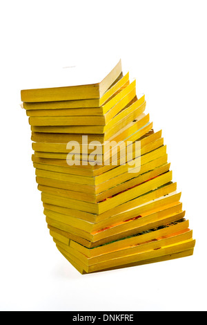 Many old paperback books with yellow pages Stock Photo