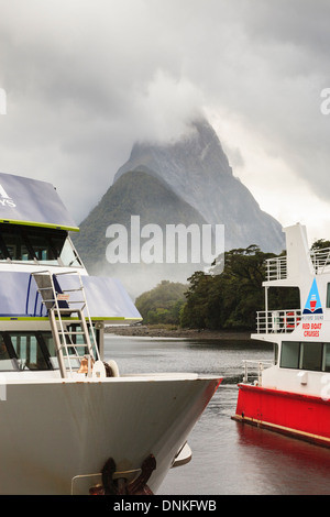 Tourists's cruise boats for tours of Milford Sound, Fiordland National Park, Southland, South Island, New Zealand Stock Photo