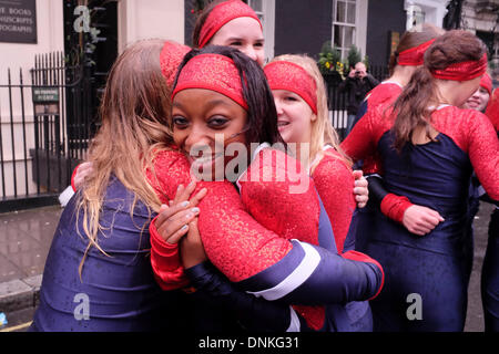 London, UK. 01st Jan, 2014. Participants and spectators in the New Year's Day parade faced wind, rain and cold on the streets of central London. Performers remained cheerful despite waiting for up to two hours in the bad weather before their turn in the parade Credit:  mark phillips/Alamy Live News Stock Photo