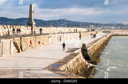 Harbour scene of a stormy East Pier in Dún Laoghaire, port and the county town of Dún Laoghaire–Rathdown, Coutny Dublin, Ireland Stock Photo