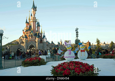 Snowman at Euro Disney Paris at christmas with Castle in Background Stock Photo