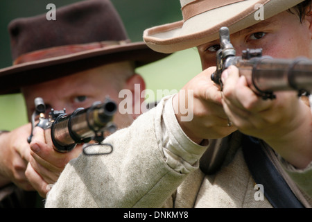 Two civil war soldiers taking aim with their rifles Stock Photo