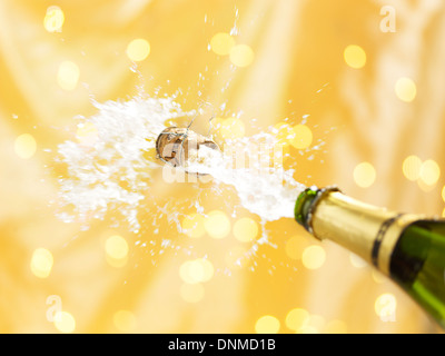 Uncorking a bottle of champagne Stock Photo