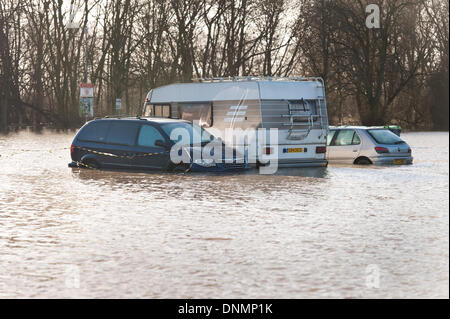 Yalding, Kent, UK. 2nd January 2014. The Environment Agency has issued a flood warning for Yalding Village in County of Kent the first one for 2014 on Thursday 2nd January. Carpark at Hampstead lane and sunken cars Credit:  Yon Marsh/Alamy Live News Stock Photo