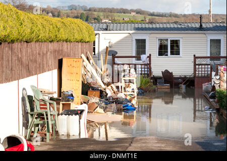 Yalding, Kent, UK. 2nd January 2014. The Environment Agency has issued a flood warning for Yalding Village in County of Kent the first one for 2014 on Thursday 2nd January. Cleanup after the damage over Christmas that looks like it is to repeat itself, ruined furniture and homes Credit:  Yon Marsh/Alamy Live News Stock Photo