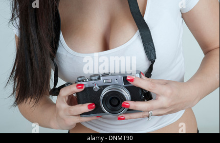 Young woman using a compact camera Stock Photo