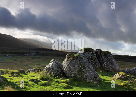 Storm clouds gather over the summit of Ingleborough, one of the Yorkshire Three Peaks mountains in the Yorkshire Dales, England Stock Photo
