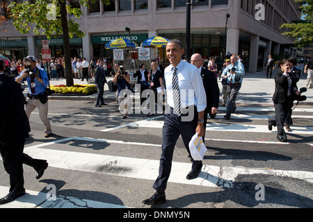 US President Barack Obama walks back to the White House from Taylor Gourmet sandwich shop October 4, 2013 in Washington, DC. The President wanted to thank the sandwich shop for offering discounts to furloughed government workers during the shutdown. Stock Photo