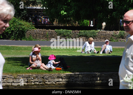 waterside fun in Bourton on the Water, Cotswolds UK Stock Photo