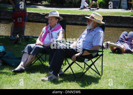waterside fun in Bourton on the Water, Cotswolds UK Stock Photo