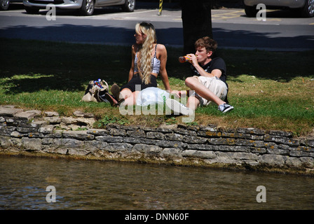 waterside fun in Bourton on the Water, Cotswolds UK Stock Photo