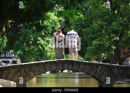 waterside fun in Bourton on the Water, Cotswolds UK Stock Photo
