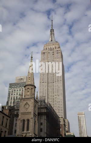 The Marble Collegiate Church paired with the Empire State Building looking up 5th Avenue in Manhattan, NYC Stock Photo