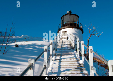 Snow covered stairway leads up to Owls Head lighthouse tower after snowfall in mid coast Maine. Stock Photo