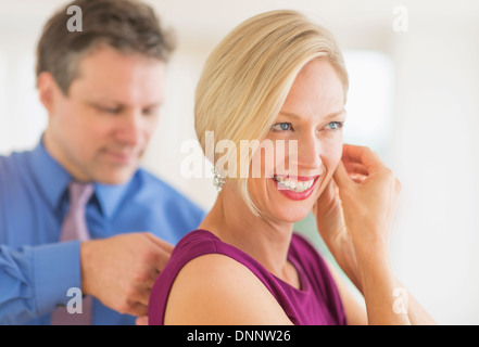 Couple in evening wear, focus on woman Stock Photo