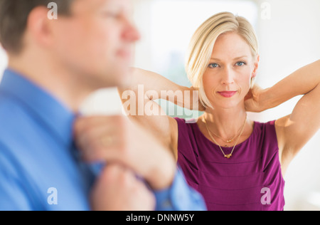 Couple in evening wear, focus on woman Stock Photo