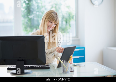 Female designer working in office Stock Photo