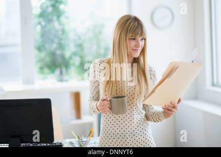 Female designer working in office Stock Photo