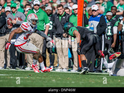 Dallas, Texas, USA. January 1st, 2014: .North Texas Mean Green wide receiver Brelan Chancellor (3) catches a pass as he is defended by UNLV Rebels defensive back Fred Wilson (24) during the 2014 Heart of Dallas Bowl football game between the University Las Vegas Nevada Rebels and the North Texas Mean Green Eagles at Cotton Bowl Stadium in Dallas, Texas. Credit:  Cal Sport Media/Alamy Live News Stock Photo