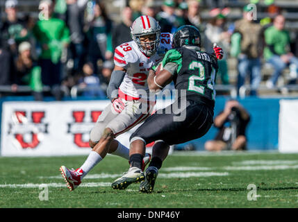 Dallas, Texas, USA. January 1st, 2014: .North Texas Mean Green running back Brandin Byrd (24) tries to shake off UNLV Rebels defensive back Tajh Hasson (29) .during the 2014 Heart of Dallas Bowl football game between the University Las Vegas Nevada Rebels and the North Texas Mean Green Eagles at Cotton Bowl Stadium in Dallas, Texas. Credit:  Cal Sport Media/Alamy Live News Stock Photo