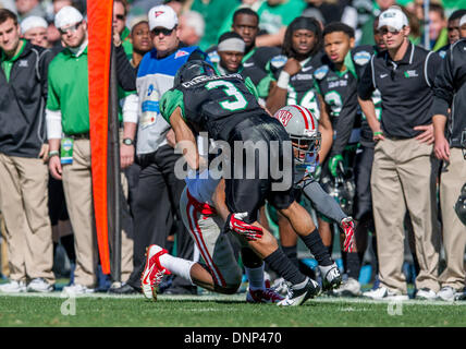 Dallas, Texas, USA. January 1st, 2014: .North Texas Mean Green wide receiver Brelan Chancellor (3) catches a pass as he is defended by UNLV Rebels defensive back Fred Wilson (24) during the 2014 Heart of Dallas Bowl football game between the University Las Vegas Nevada Rebels and the North Texas Mean Green Eagles at Cotton Bowl Stadium in Dallas, Texas. Credit:  Cal Sport Media/Alamy Live News Stock Photo