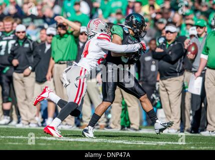 Dallas, Texas, USA. January 1st, 2014: .North Texas Mean Green wide receiver Brelan Chancellor (3) catches a pass as he is defended by UNLV Rebels defensive back Fred Wilson (24) during the 2014 Heart of Dallas Bowl football game between the University Las Vegas Nevada Rebels and the North Texas Mean Green Eagles at Cotton Bowl Stadium in Dallas, Texas. Credit:  Cal Sport Media/Alamy Live News Stock Photo