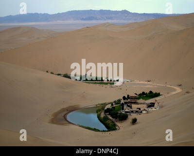 Huge sand dunes around Yueyaquan  crescent lake (crescent moon lake), Mingsha Shan, south of Dunhuang, Gansu, China. Stock Photo