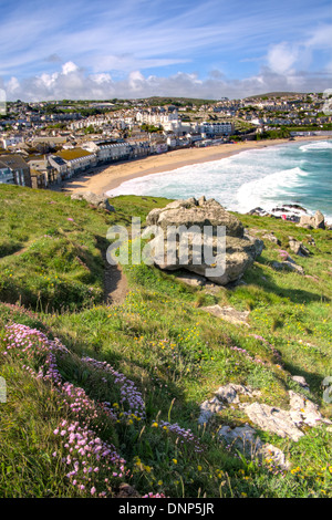 The arc of yellow sand at Porthmeor Beach in St Ives, taken from The Island. Cornwall, United Kingdom Stock Photo