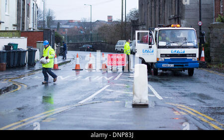 Bristol, UK. 3rd January 2014. Workers close roads and deliver sand bags as a precaution against flooding from the river Avon in Bristol following high tides and heavy rain. 3 January 2014 Credit:  Adam Gasson/Alamy Live News Stock Photo