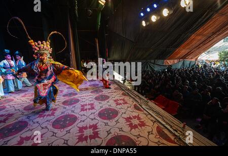 Wuyi, China's Zhejiang Province. 3rd Jan, 2014. Actors of a local traditional opera troupe perform at Sanbanqiao Village of Wuyi County in Jinhua City, east China's Zhejiang Province, Jan. 3, 2014. The Wu Opera, also called Jinhua Opera, is a local traditional opera with a histoy of more than 400 years. Wu Opera troups here would perform for local residents to celebrate festivals like the New Year. © Xu Yu/Xinhua/Alamy Live News Stock Photo