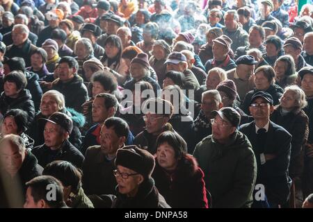 Wuyi, China's Zhejiang Province. 3rd Jan, 2014. Villagers watch a local traditional opera troupe performing at Sanbanqiao Village of Wuyi County in Jinhua City, east China's Zhejiang Province, Jan. 3, 2014. The Wu Opera, also called Jinhua Opera, is a local traditional opera with a histoy of more than 400 years. Wu Opera troups here would perform for local residents to celebrate festivals like the New Year. © Xu Yu/Xinhua/Alamy Live News Stock Photo