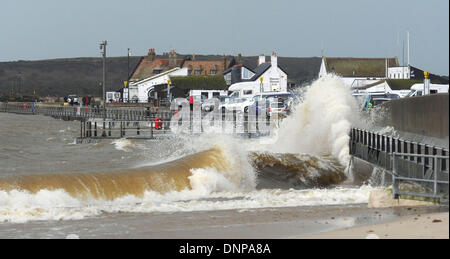 Mudeford Quay, Hampshire, UK . 03rd Jan, 2014. Waves crash over Mudeford Quay, near Christchurch, Hampshire, at high tide as storms lash the south coast of England 3 January 2014. Credit:  John Beasley/Alamy Live News Stock Photo