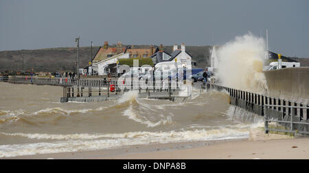 Mudeford Quay, Hampshire, UK . 03rd Jan, 2014. Waves crash over Mudeford Quay, near Christchurch, Hampshire, at high tide as storms lash the south coast of England 3 January 2014. Credit:  John Beasley/Alamy Live News Stock Photo