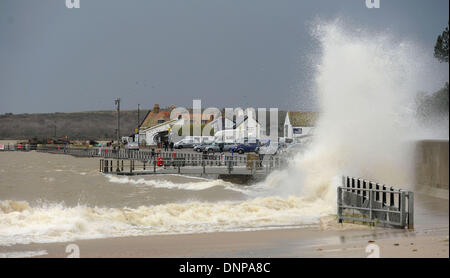 Mudeford Quay, Hampshire, UK . 03rd Jan, 2014. Waves crash over Mudeford Quay, near Christchurch, Hampshire, at high tide as storms lash the south coast of England 3 January 2014. Credit:  John Beasley/Alamy Live News Stock Photo