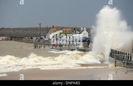 Mudeford Quay, Hampshire, UK . 03rd Jan, 2014. Waves crash over Mudeford Quay, near Christchurch, Hampshire, at high tide as storms lash the south coast of England 3 January 2014. Credit:  John Beasley/Alamy Live News Stock Photo