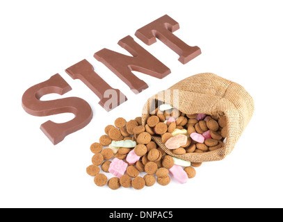 Word SINT and bag of ginger nuts and sweets for Dutch event Sinterklaas in december Stock Photo