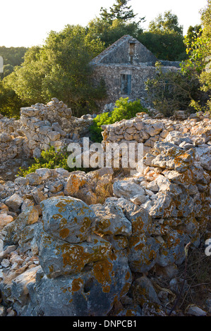 Ruins of buildings destroyed by 1953 earthquake in Andipata Erisou near Fiscardo, Kefalonia, Greece Stock Photo