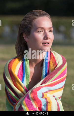 Netherlands, Gelderland, De Rijkerswoerdse Plassen, Woman wrapped in stripped towel Stock Photo
