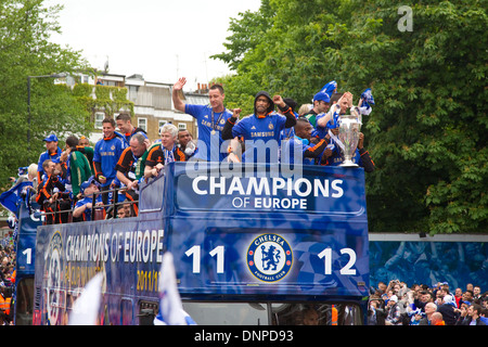 Chelsea players and staff parade the European and F A Cups in an open top bus down the Fulham Road Stock Photo