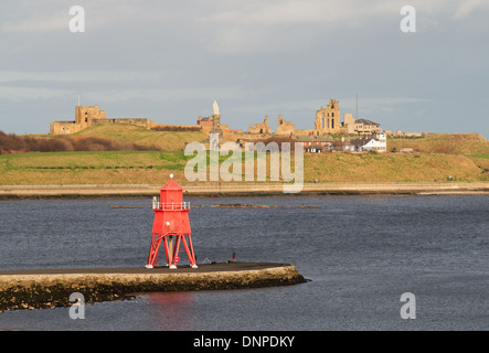Tynemouth priory and the Herd Groyne pier and lighthouse South Shields, north east England UK Stock Photo