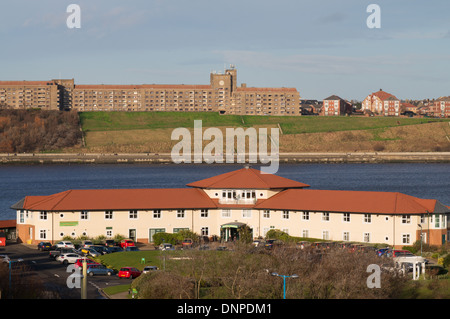 Little Haven Hotel South Shields with Sir James Knott Memorial Flats north Shields in the background, north east England UK Stock Photo