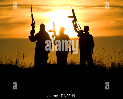 soldiers against a sunset Stock Photo