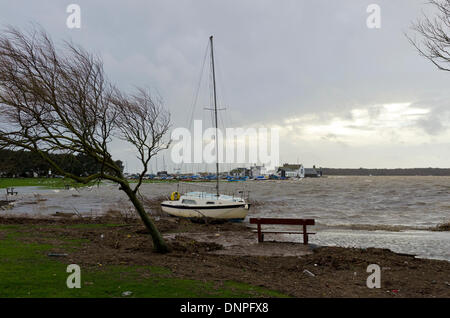 Christchurch, UK. 03rd Jan, 2014. Yacht breaks mooring, drifts ashore in Christchurch Harbour Credit:  Roger Allen Photography/Alamy Live News Stock Photo