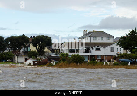 Christchurch, UK. 03rd Jan, 2014. Local harbourside houses battered by storm winds and waves with some flooding Credit:  Roger Allen Photography/Alamy Live News Stock Photo