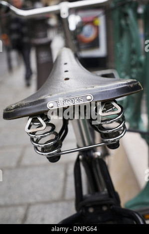 Paris, France - bicycle parked on a city street. Classic Brooks leather bike saddle. Stock Photo