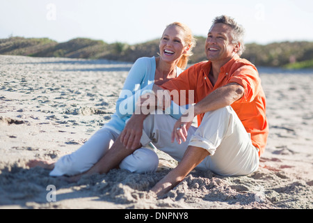 Mature Couple Sitting on Beach, Jupiter, Palm Beach County, Florida, USA Stock Photo