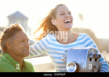 Mature Couple being Playful by Scenic Viewer on Pier, USA Stock Photo