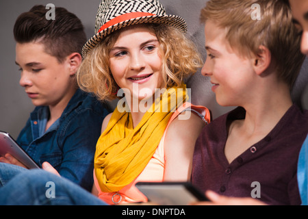 Teenagers with Tablet PC, Studio Shot Stock Photo
